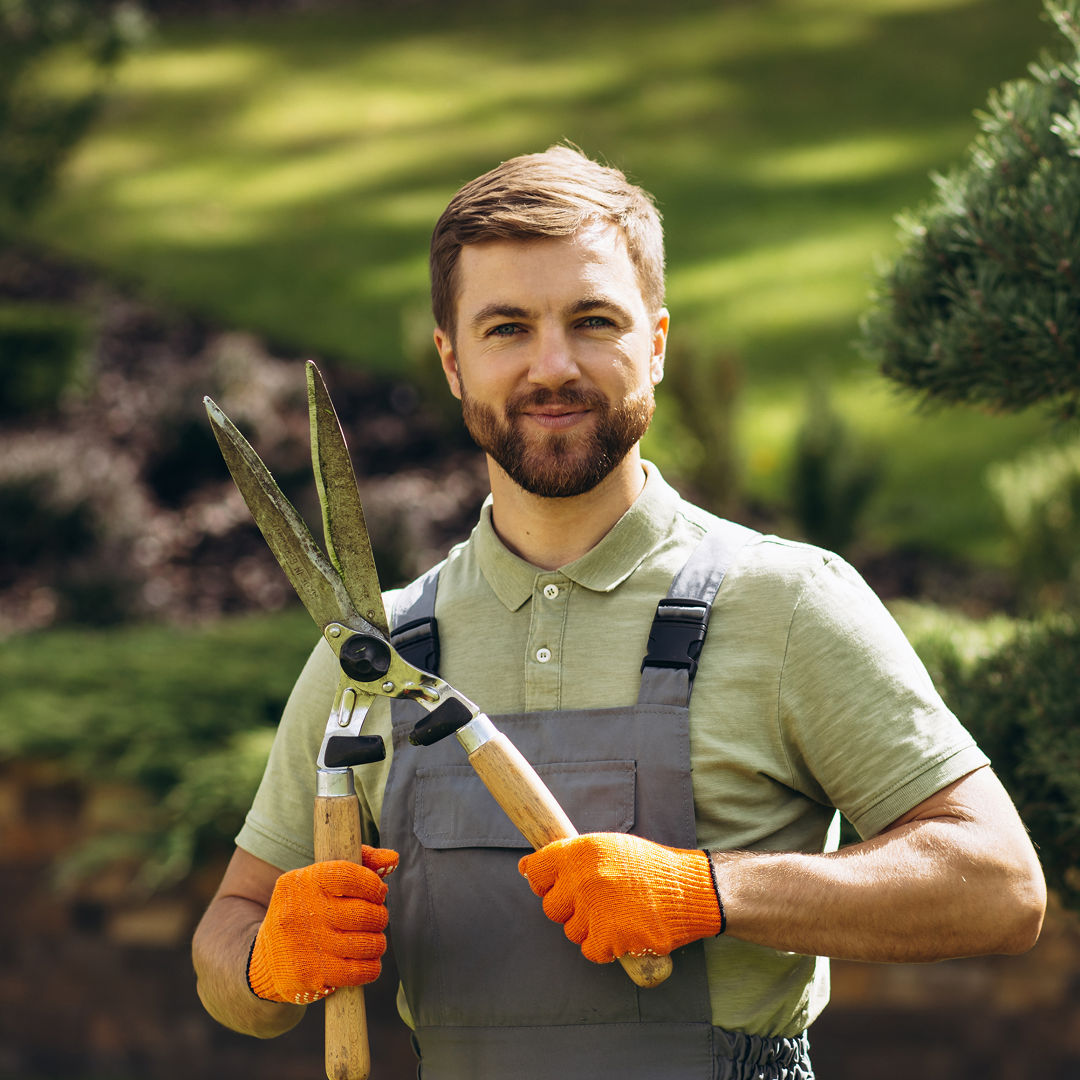Landscaper installing patio stones in a residential backyard