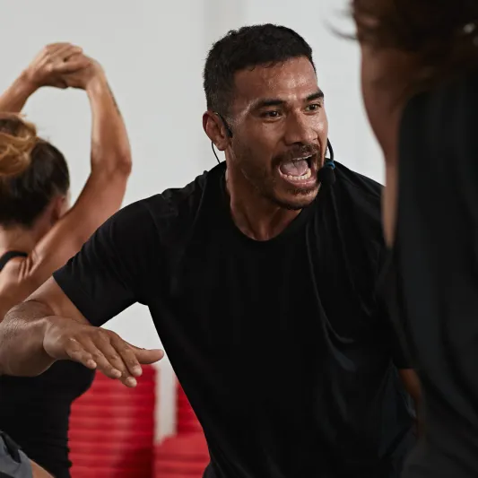 An instructor teaching a class participant