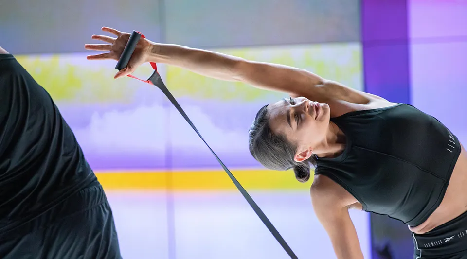 Person in athletic wear performing a stretch