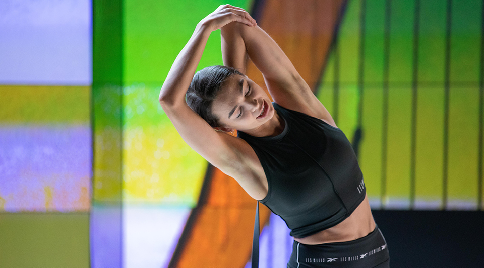 Person in athletic wear performing a stretching or yoga pose