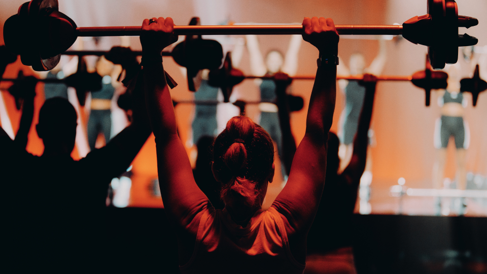 A BODYPUMP workout filming