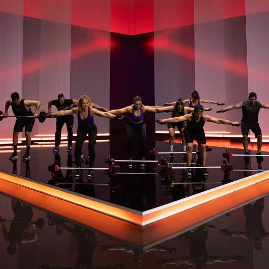 A group of instructors doing LES MILLS BODYPUMP