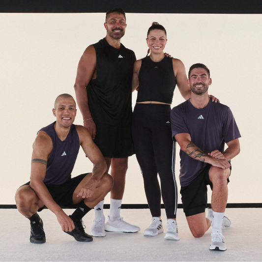 A group of instructors smiling at the camera having just completed a BodyStep workout