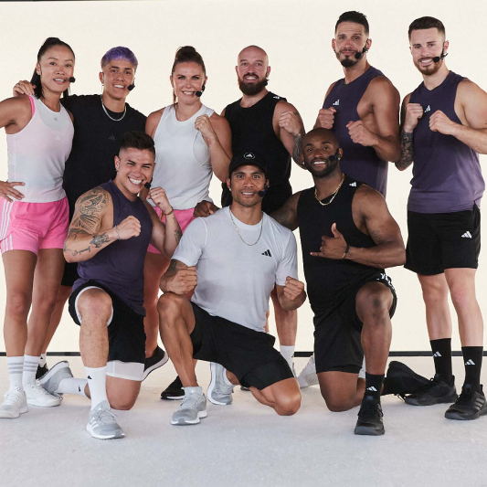 A group of instructors smiling at the camera having just completed a BodyCombat workout