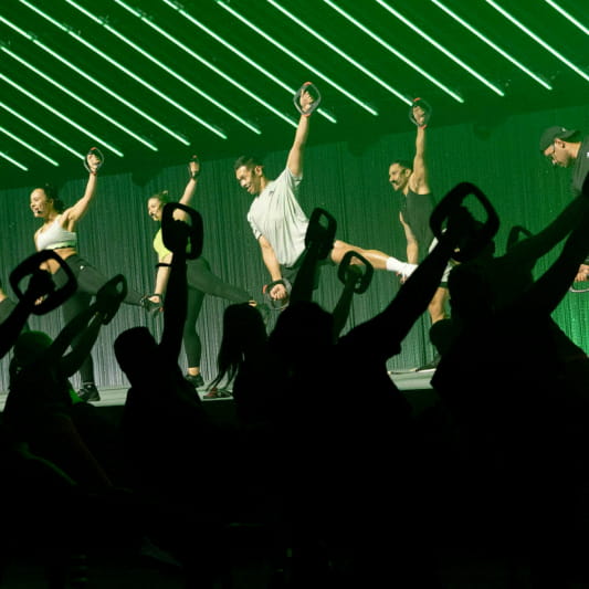 A group of Instructors demonstrating a Les Mills Tone workout