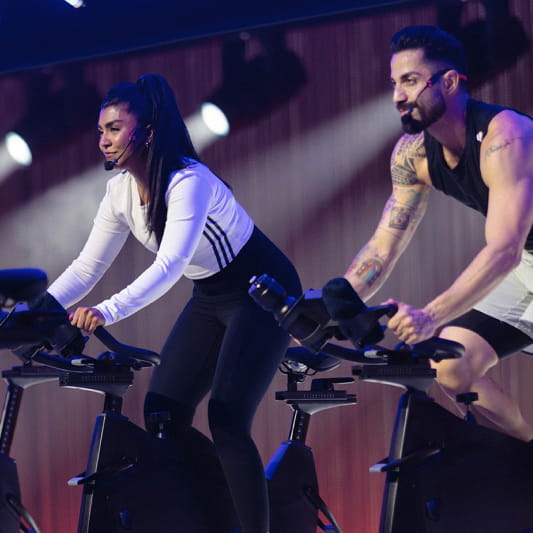 A group of Instructors demonstrating a RPM workout