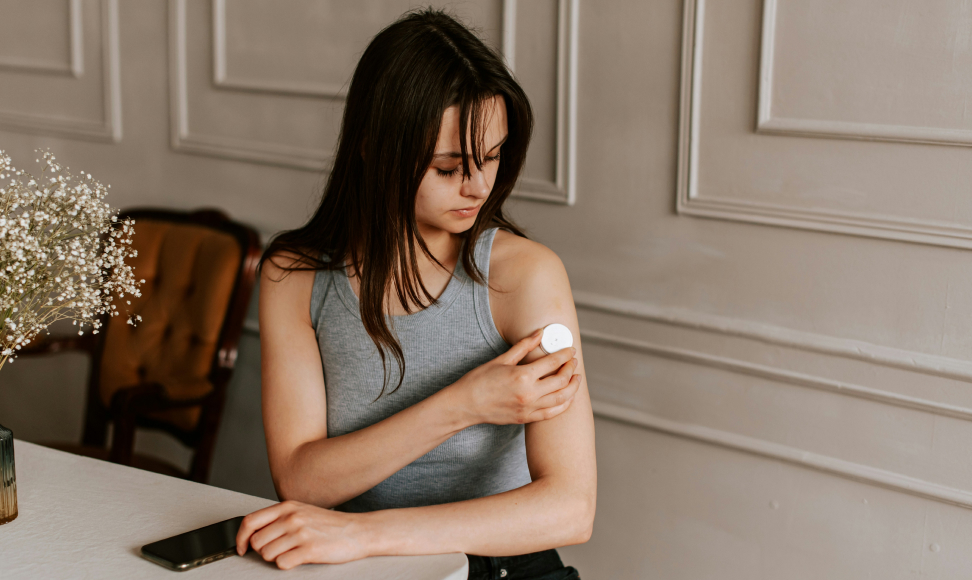 Girl checking her glucose monitor