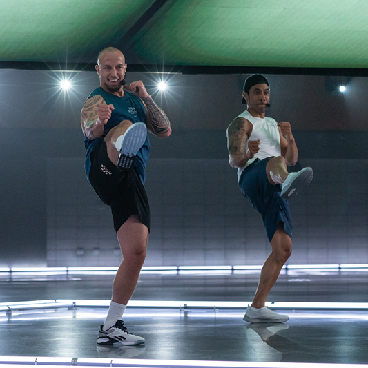 Les Mills Presenters performing high kicks