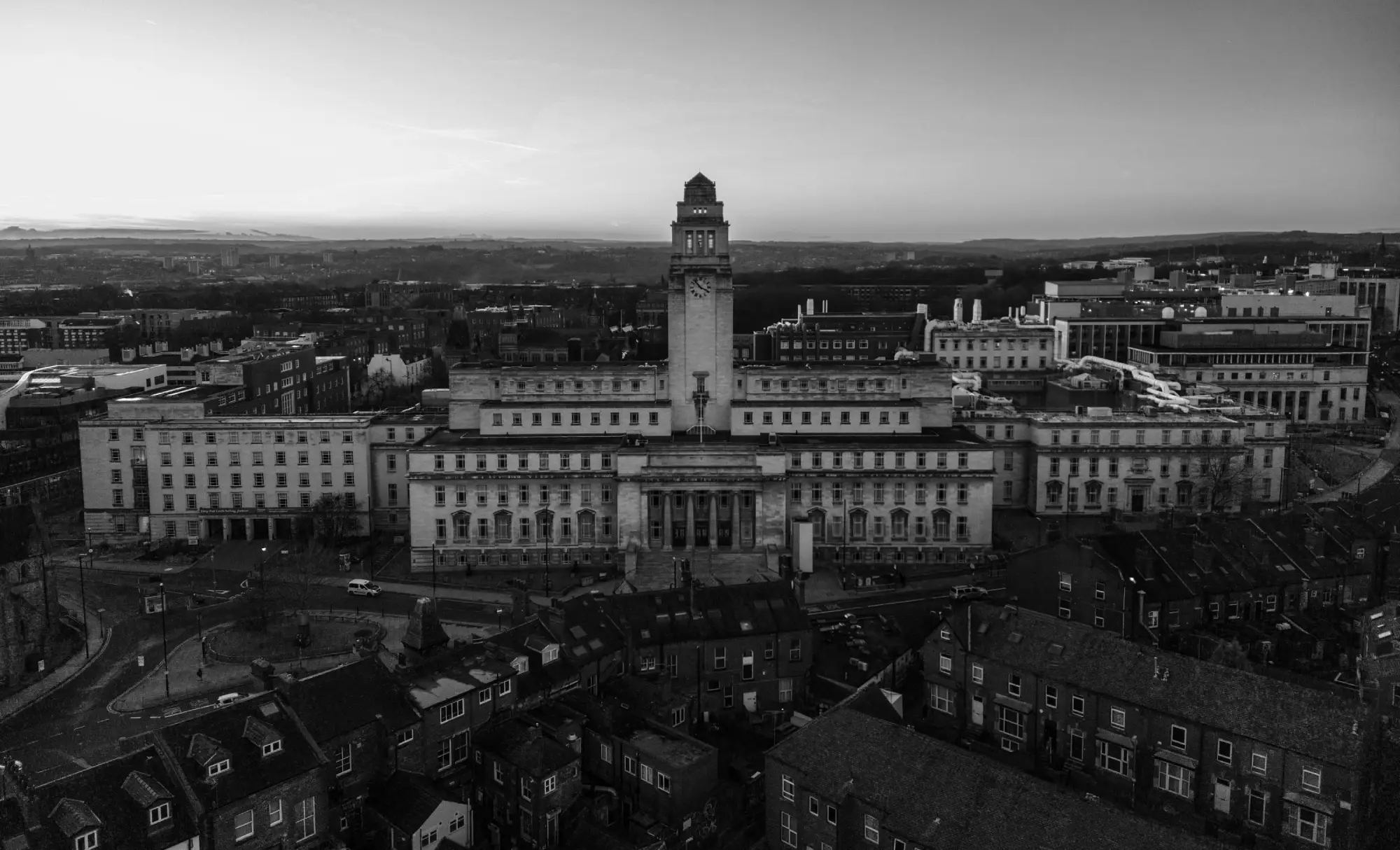 Aerial view of the Parkinson Building at the University of Leeds, United Kingdom, featuring its tall clock tower and neoclassical architecture