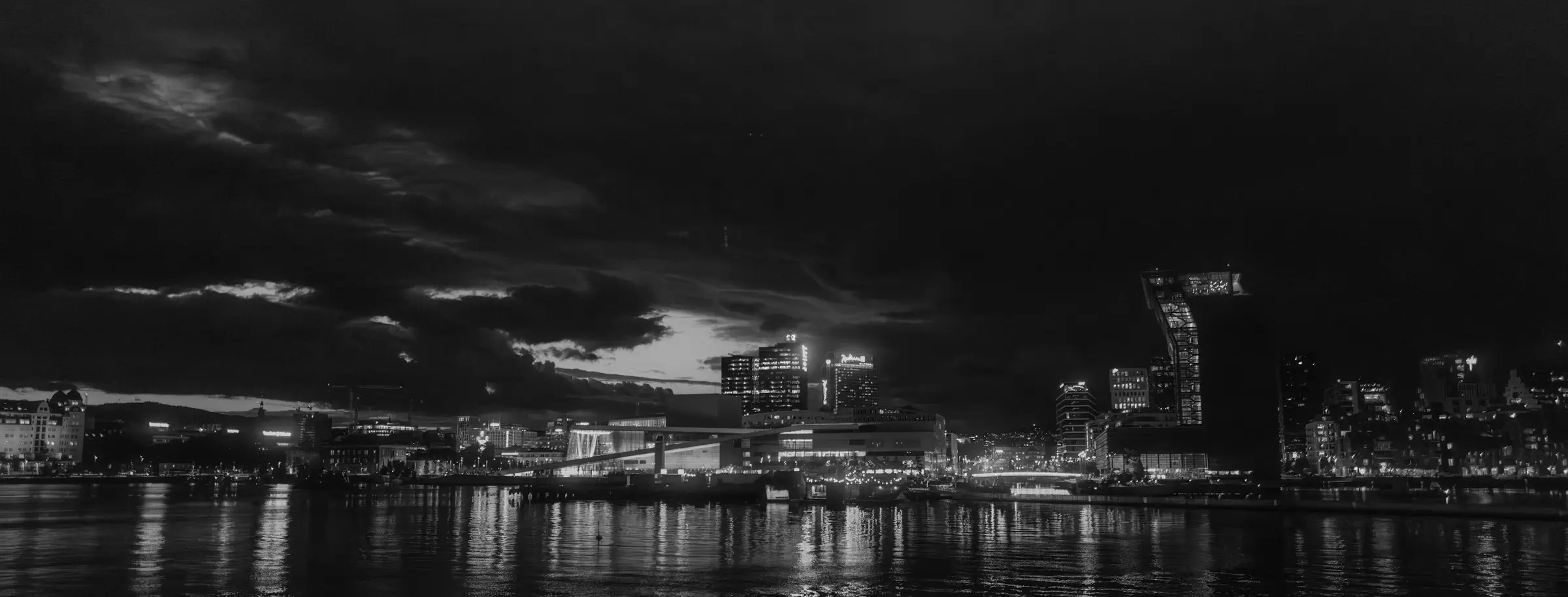 Nighttime cityscape of Oslo with modern high-rises