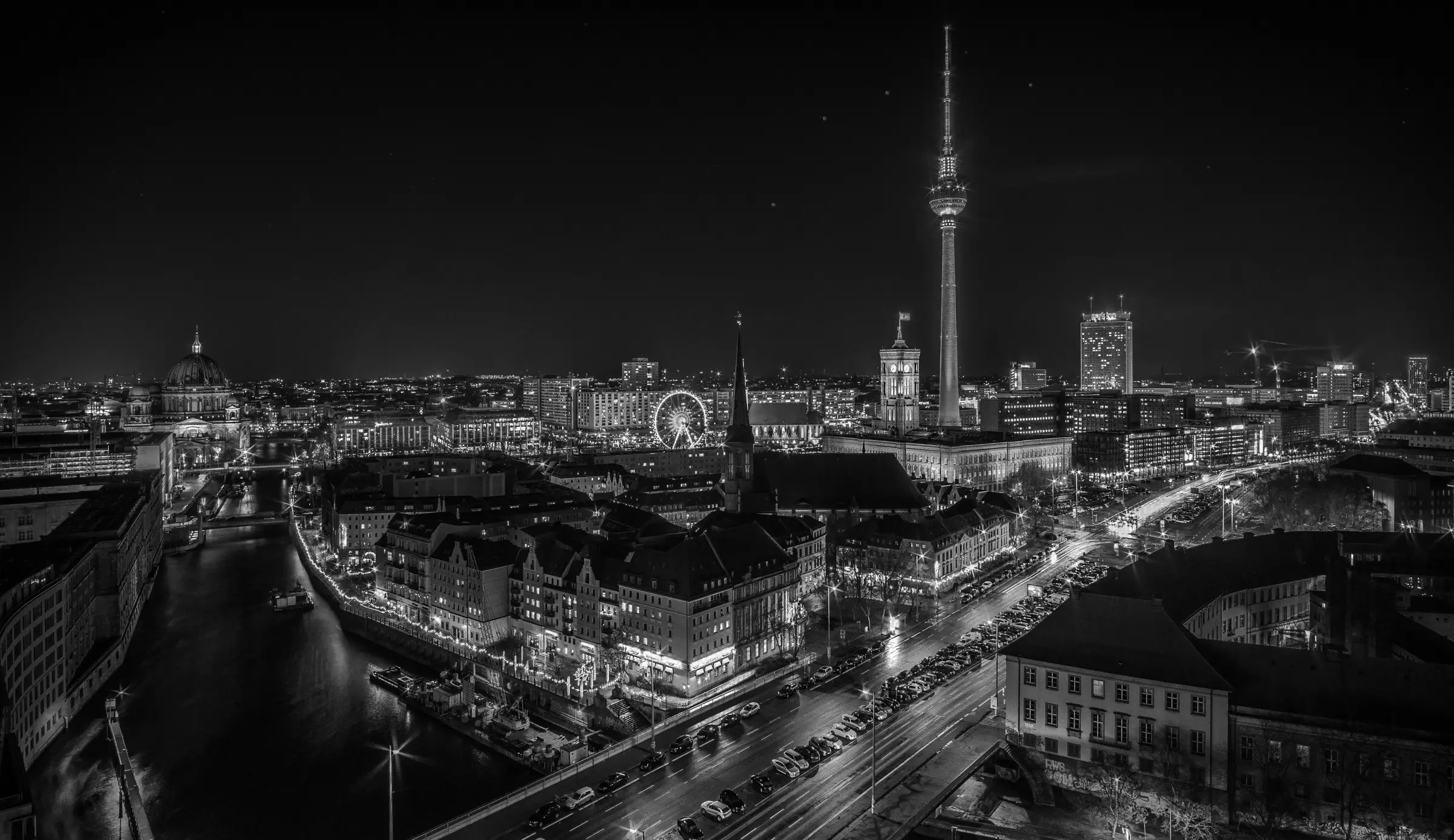 Nighttime view of Berlin featuring the TV Tower and Berlin Cathedral