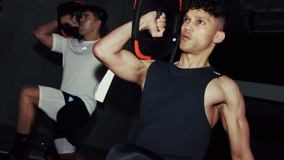 Two Les Mills Instructors working out with a Smartbar plate