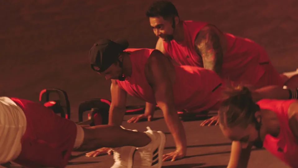 Group of Les Mills Instructors performing a plank