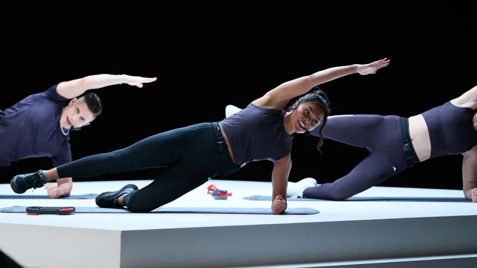 Les Mills Instructors performing side plank