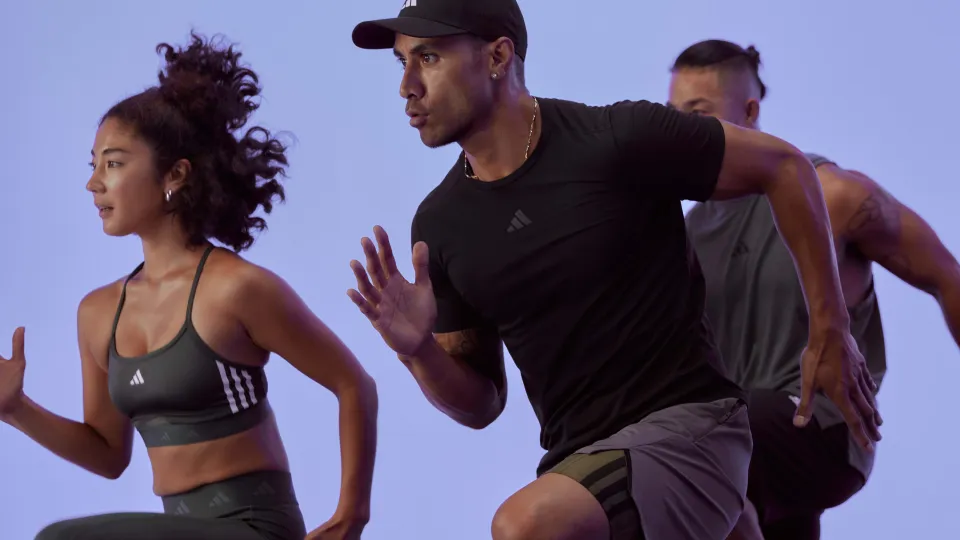 three people mid-motion running