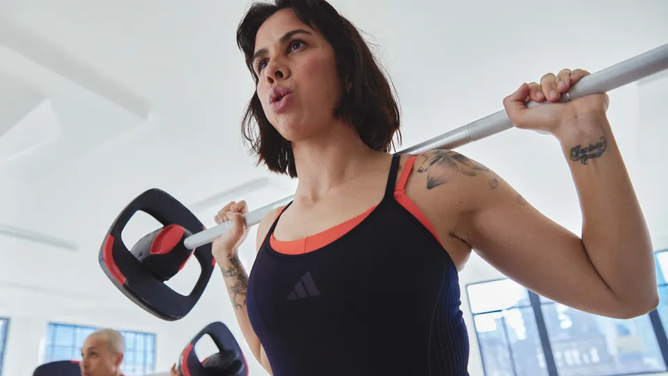 a woman lifting a smartbar