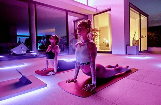two women doing yoga
