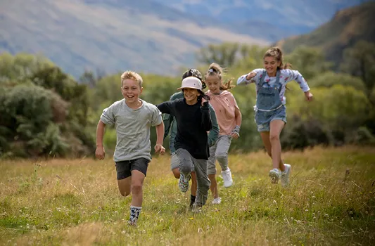 children running in a field