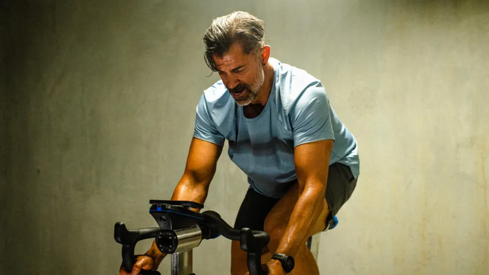 a man in a spin bike