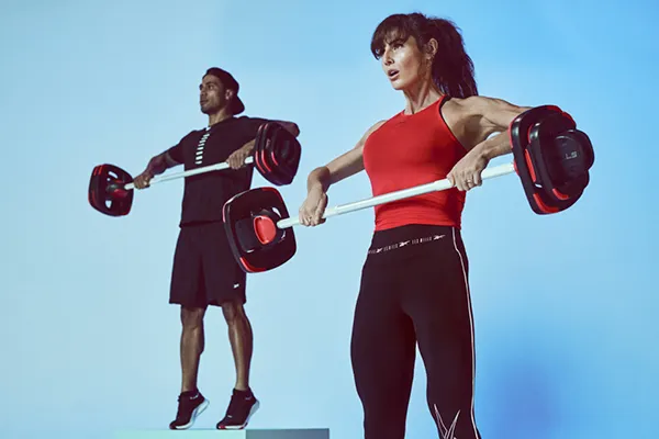 Two people lifting smartbar