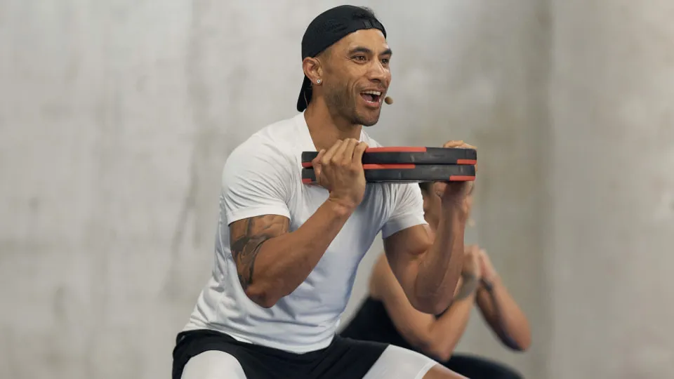 a person lifting smartbar plates