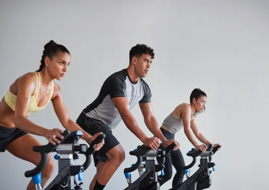 people in spin bikes