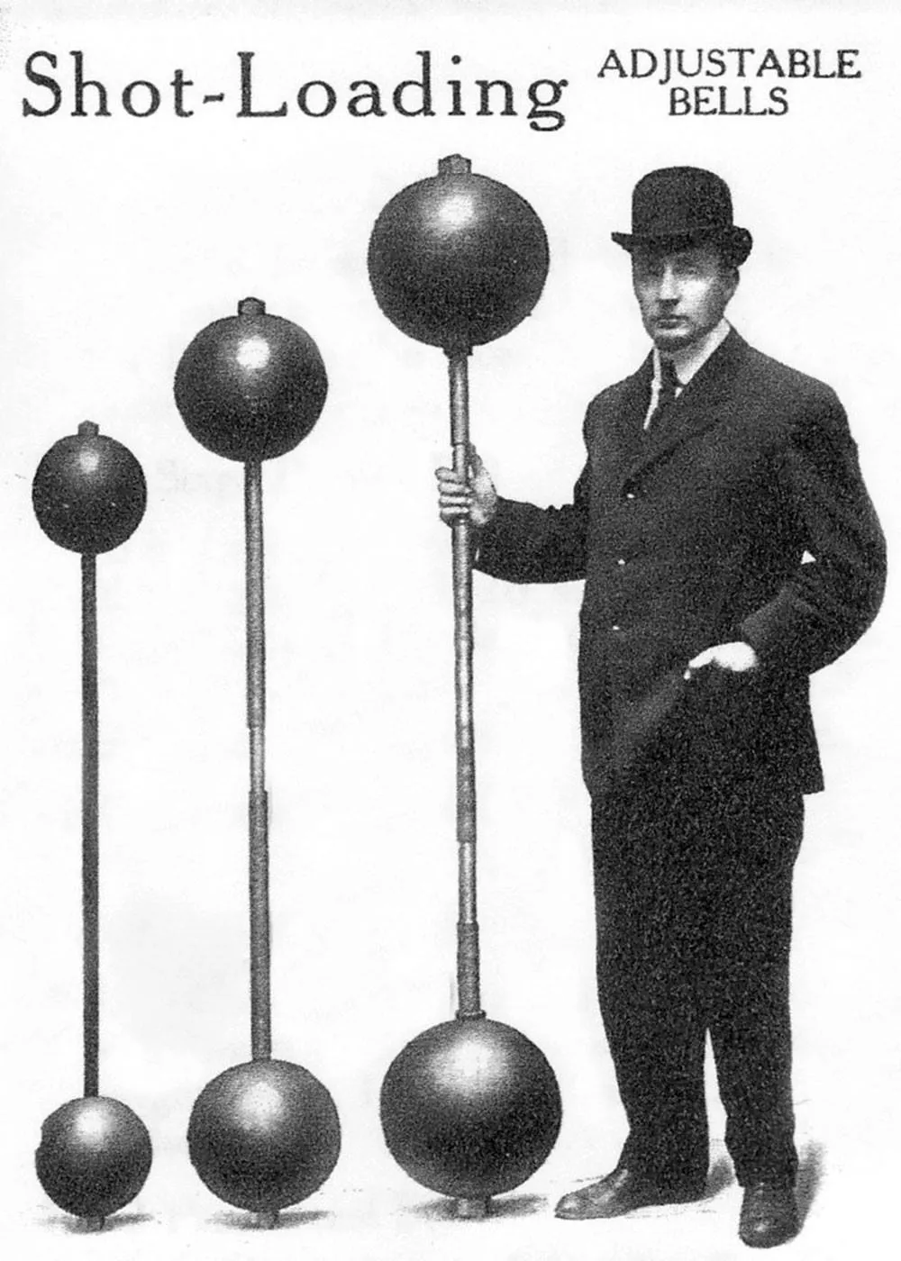 Person in a dark suit and hat standing beside four tall shot-loading adjustable barbells with large spherical weights, arranged in ascending size, against a plain white background with text at the top.