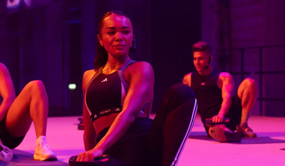 A woman sitting down in an exercise class