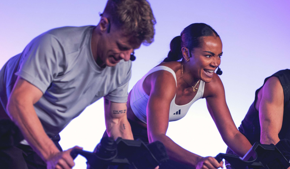 A male and female instructor in a cycle workout