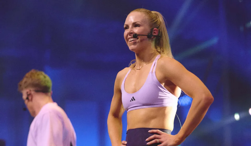 Erin Maw on stage filming workouts