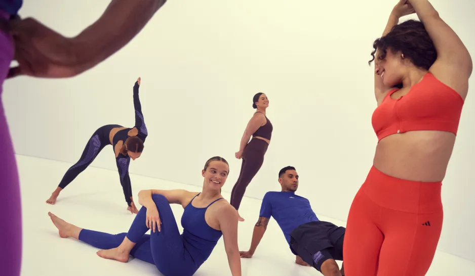 Women and men stretching in a Pilates class