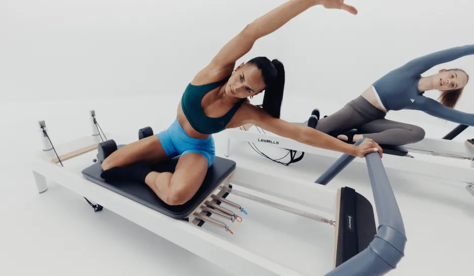 Two women in a LES MILLS REFORMER class