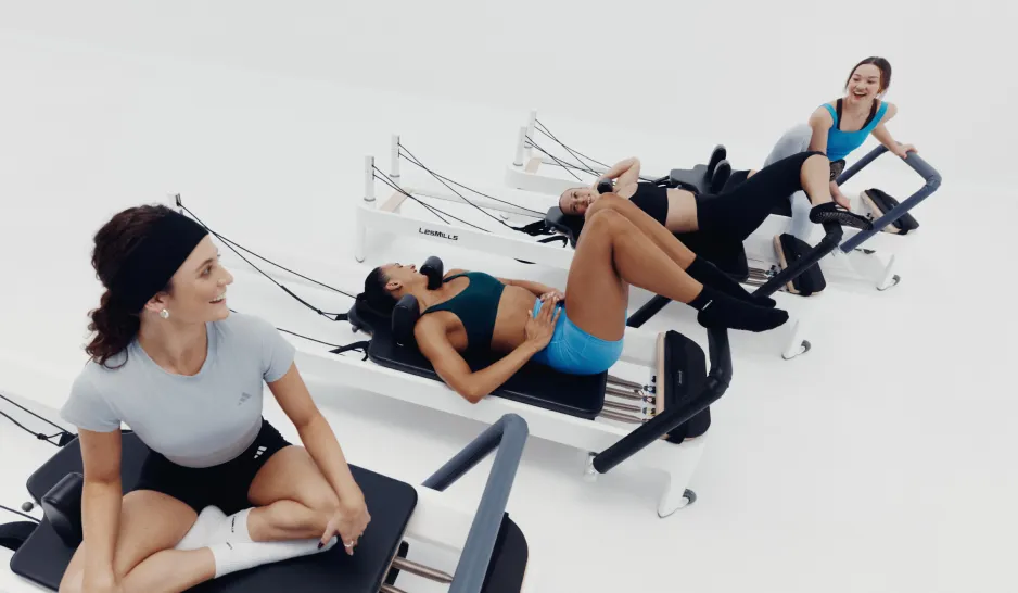 People exercising together on Pilates reformers