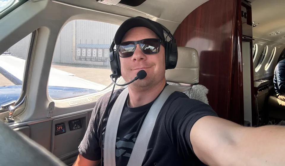 A male pilot in the cockpit
