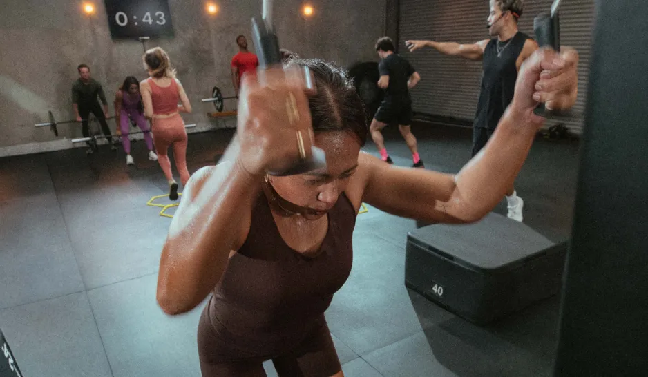 A woman using the Ski Erg in a circuit workout