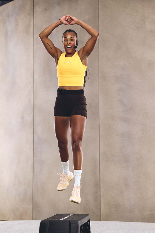 Les Mills Instructor jumps high over Les Mills step