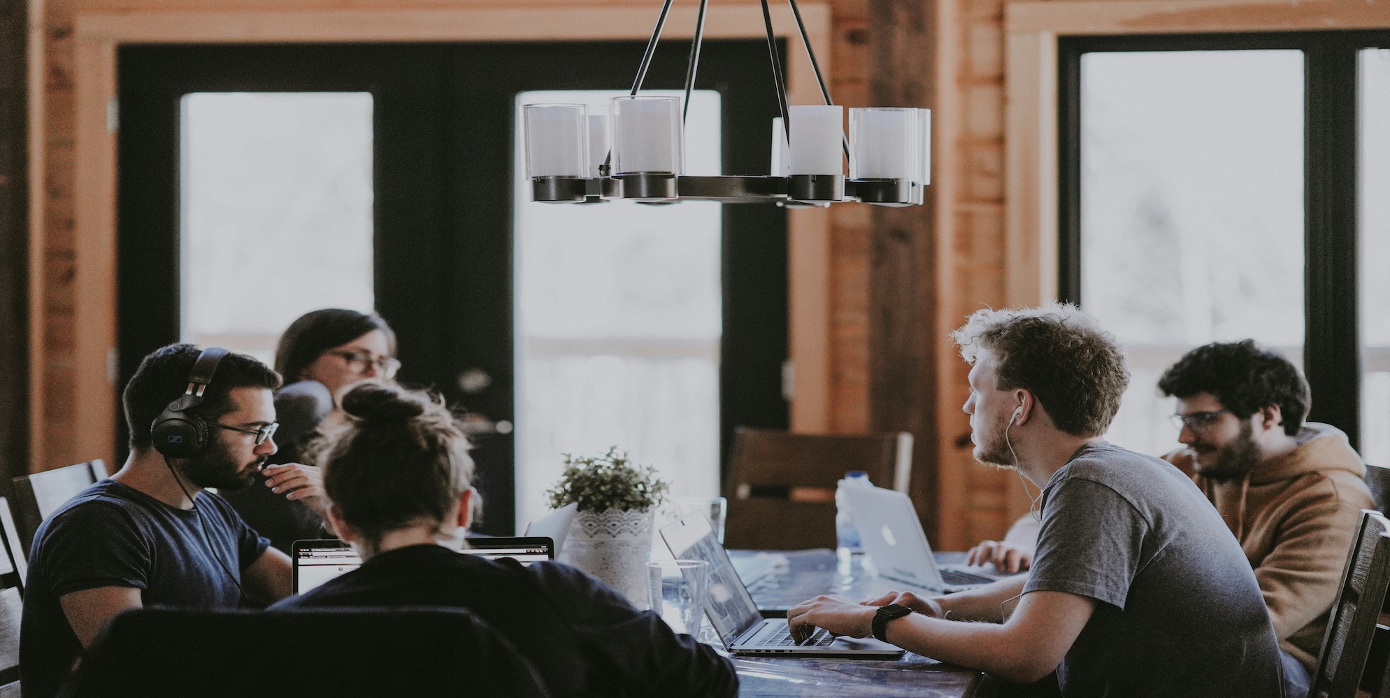 Side-by-side comparison of Xero and MYOB accounting software interfaces on laptop screens with Australian business documents and calculator