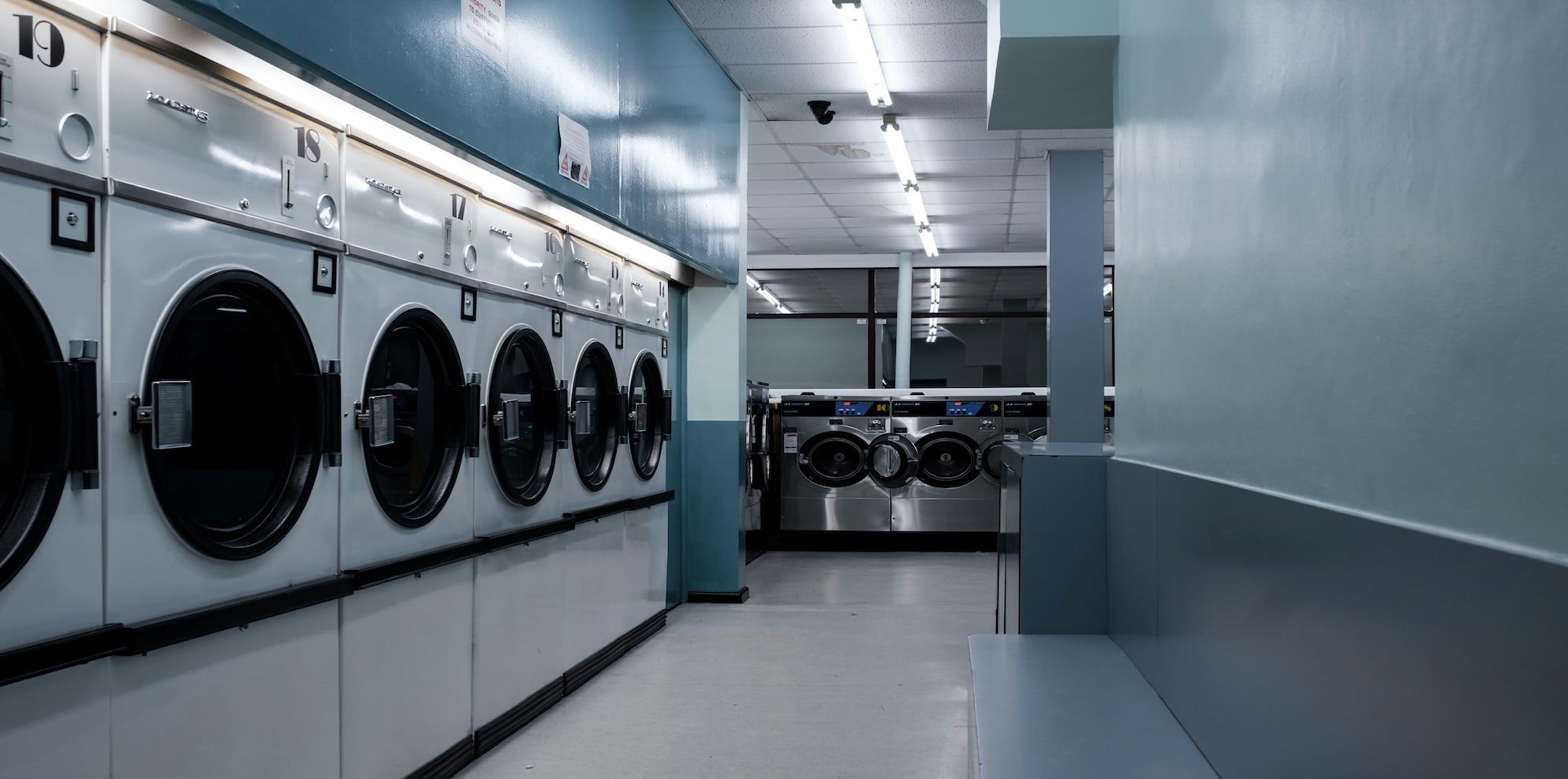 Automated Sydney laundromat interior showing Speed Queen card-payment washers and dryers in a clean well-lit suburban shopfront