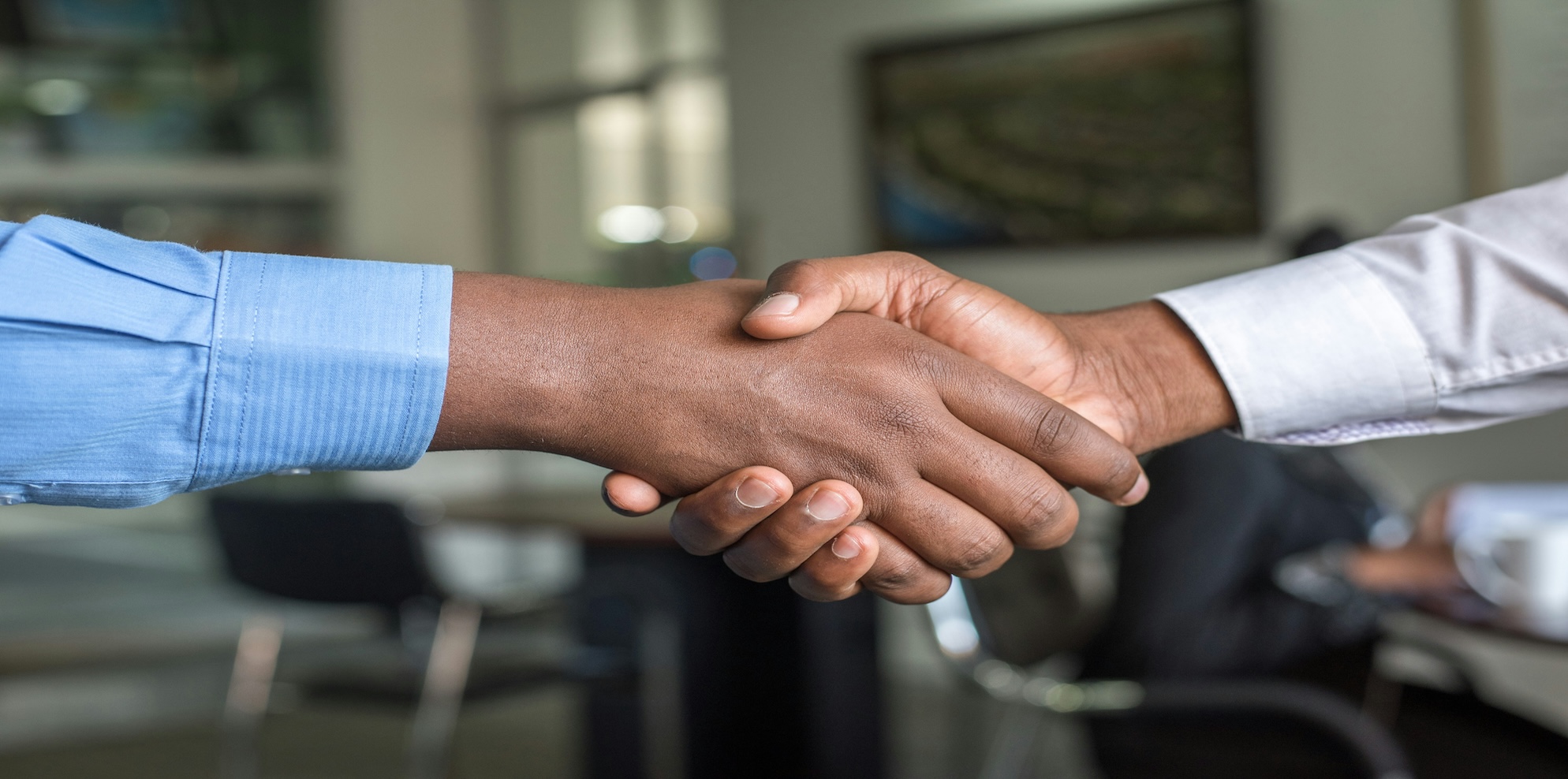 partner picking and shaking hands for outsourced finance selection for growing businesses