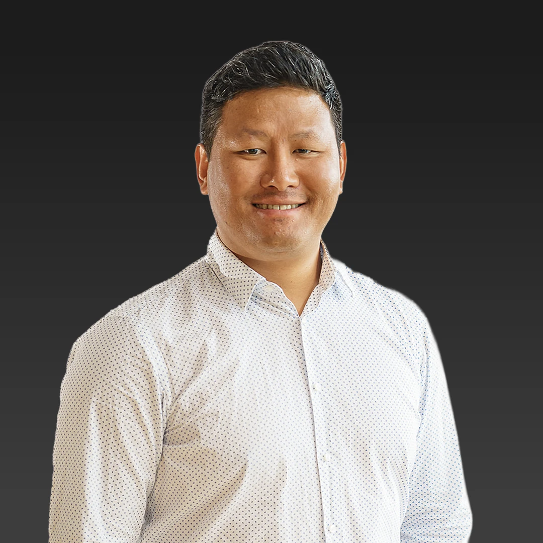 Profile Picture of Suraj Gurung standing against a dark gradient background.