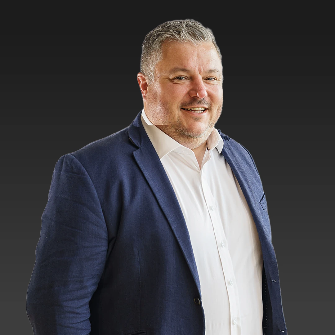 Profile Picture of Paul Sanderson standing against a dark gradient background.