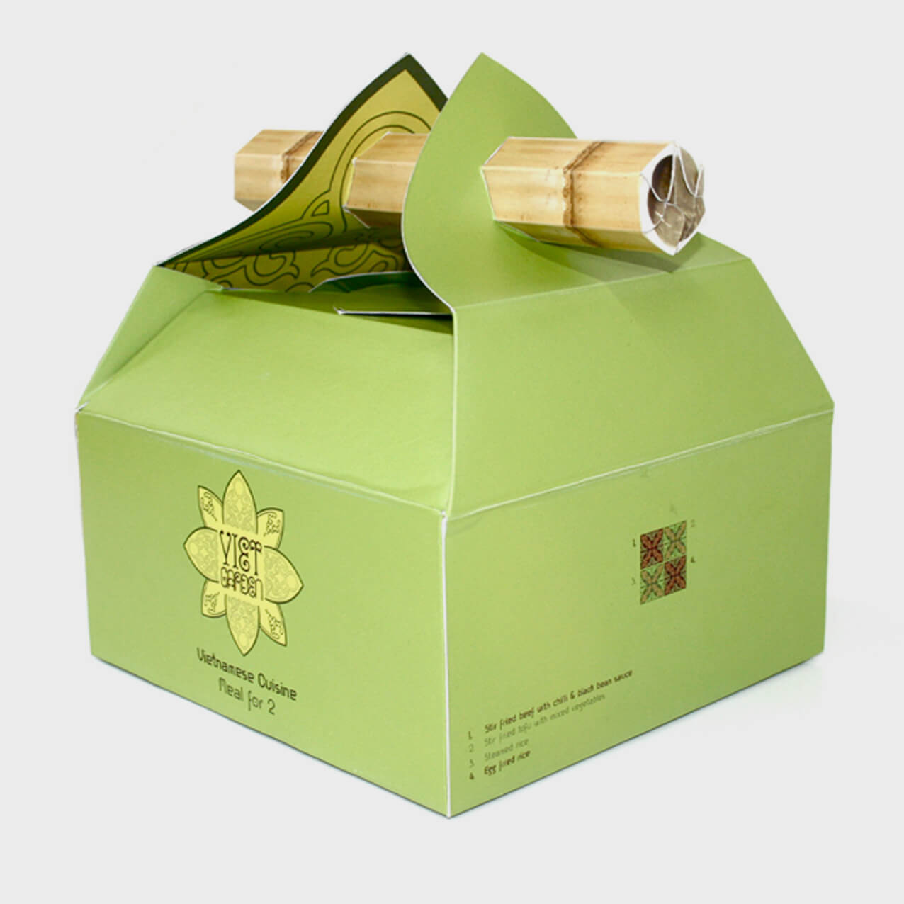 Custom packaging design for Viet Garden by Sprouto, featuring a green takeaway box with bamboo handles, showcasing the brand's logo and minimalist design for Vietnamese cuisine. 
