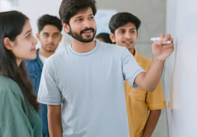 Students and teacher at a whiteboard in 3Edge classroom