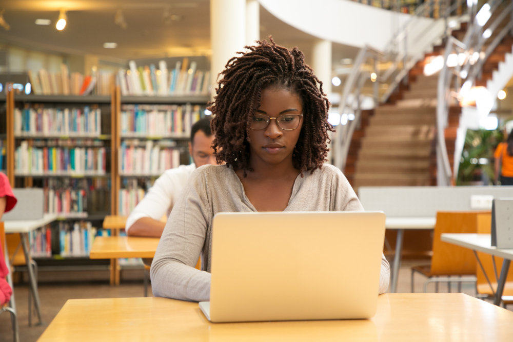 woman in a library - Benefits of AI for Students