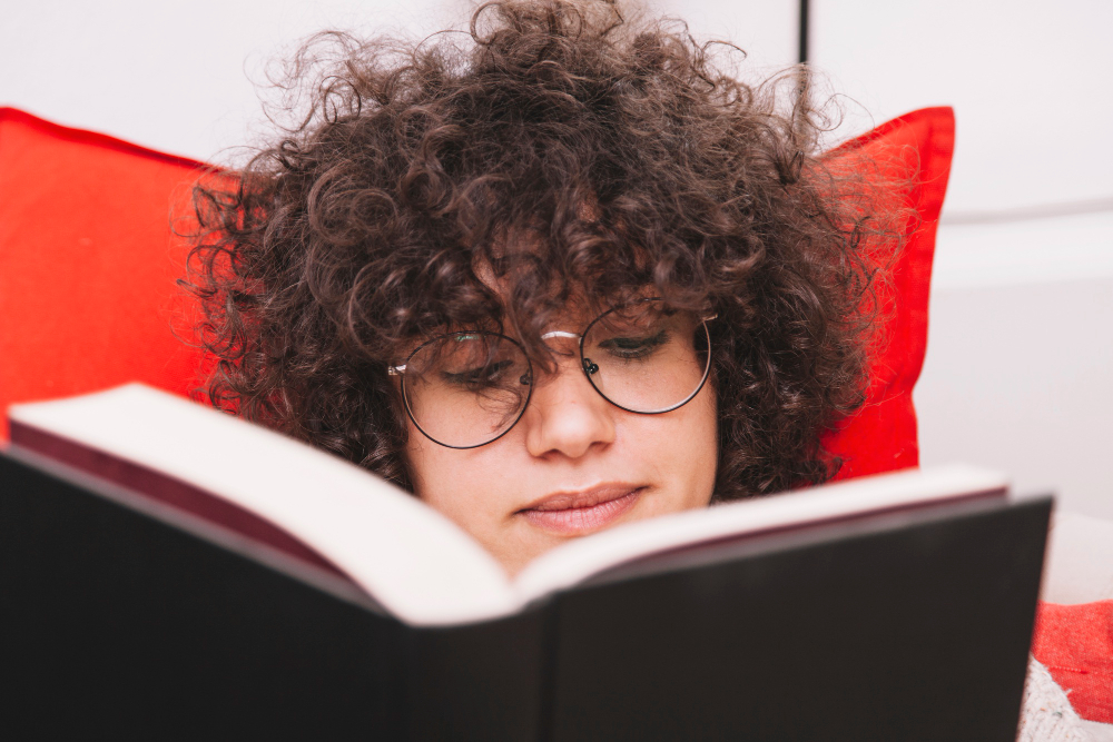 woman reading a book - Is Geography A Level Hard