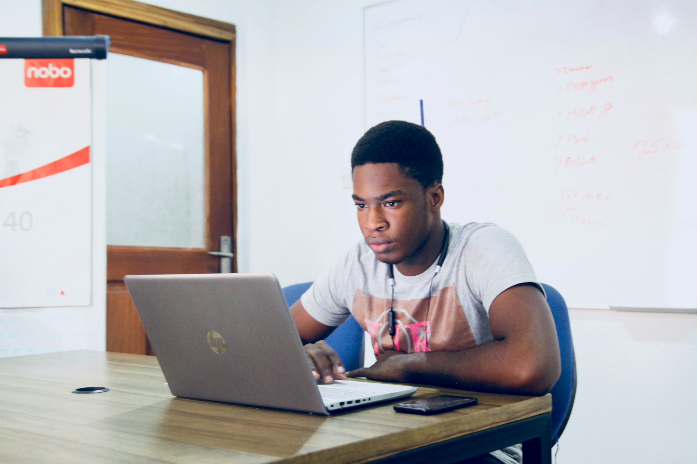Person Studying on Laptop - How to Revise Psychology A Level