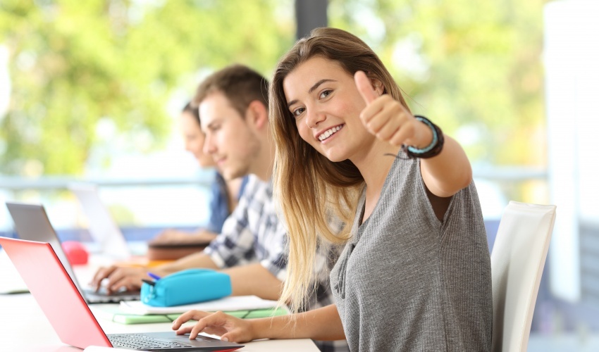 woman showing a thunmbs up - How Many A Levels Can You Take