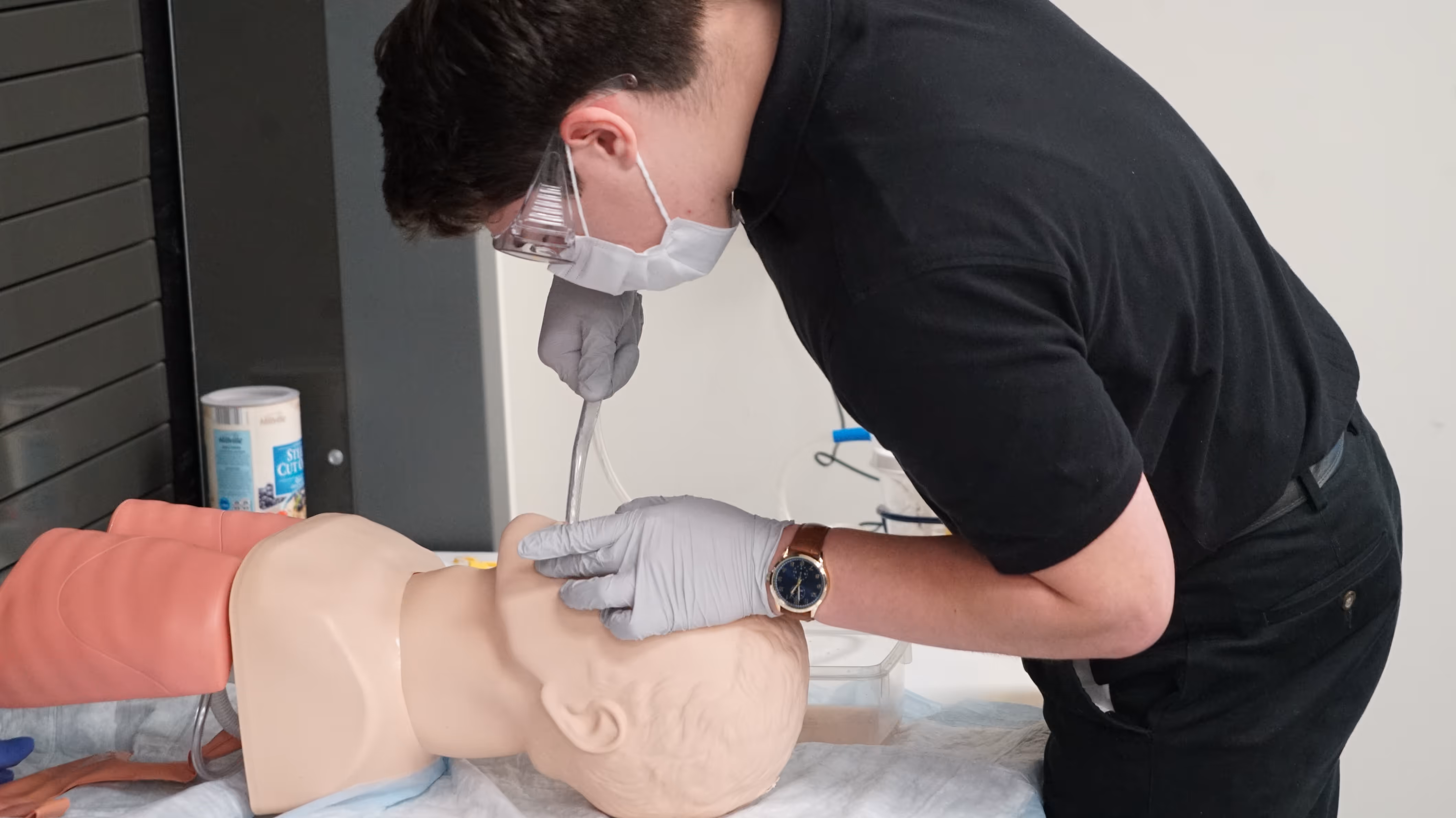 Student working on medical manikin