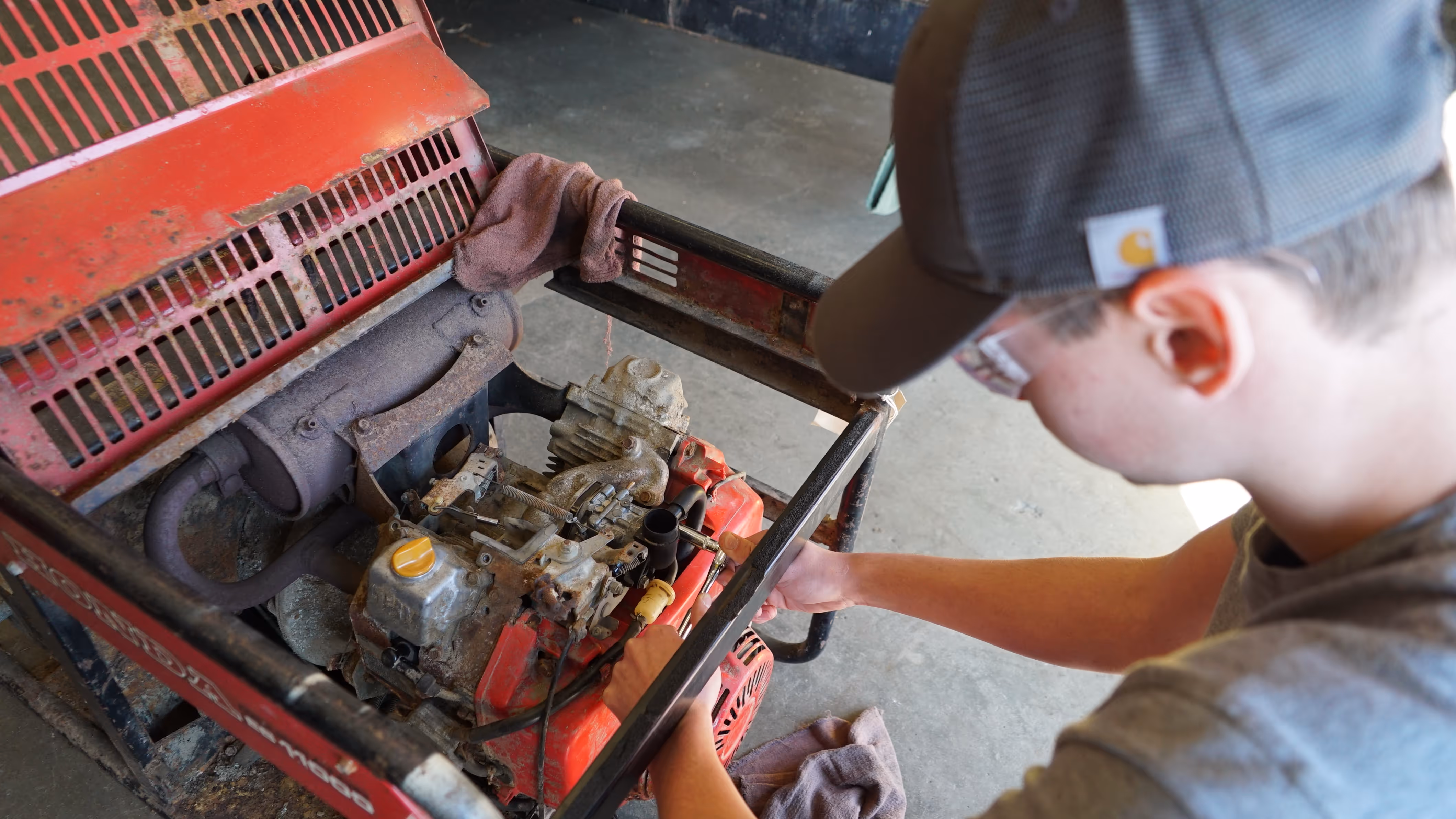 Student working on small engine