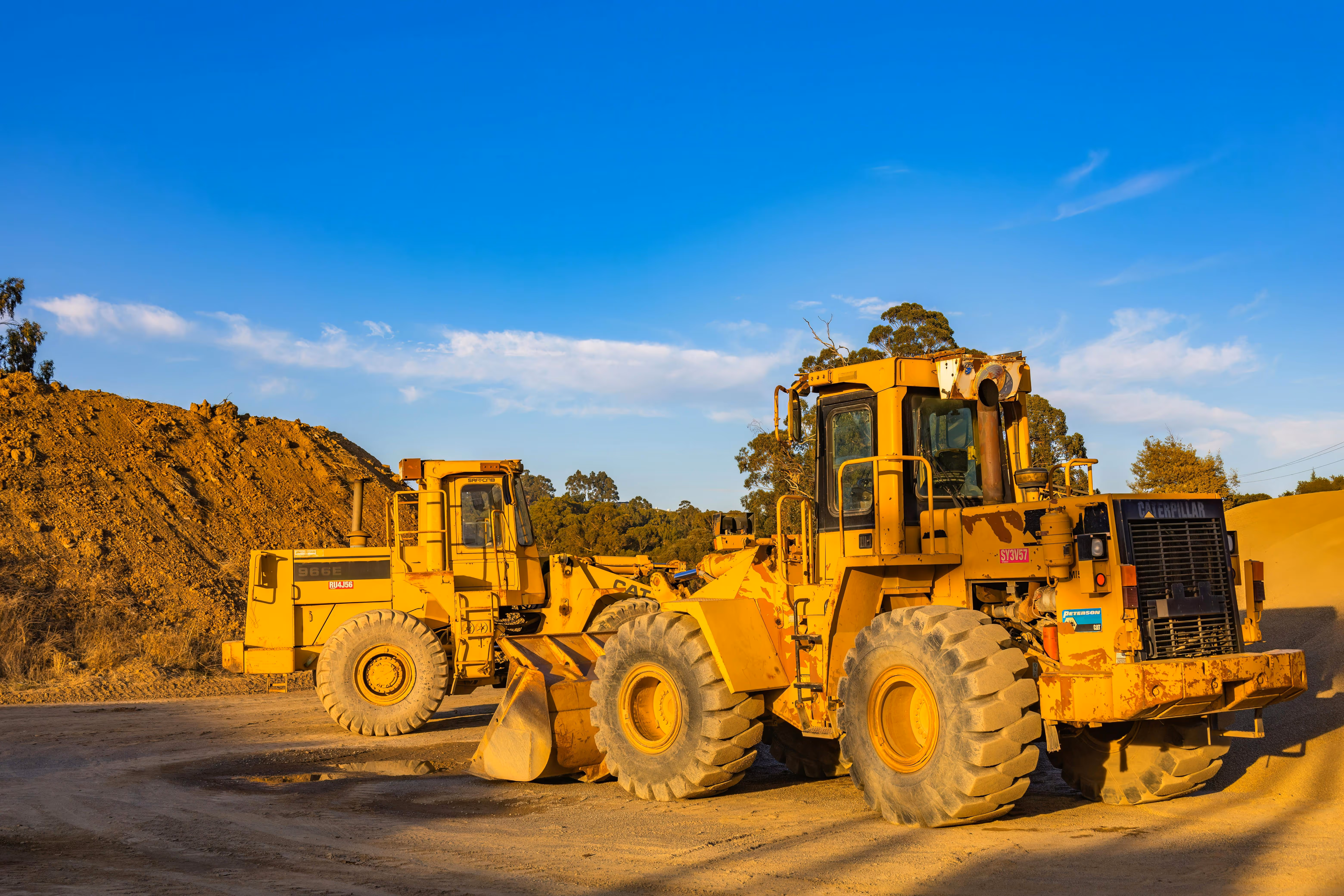 Heavy Equipment are working in the field.